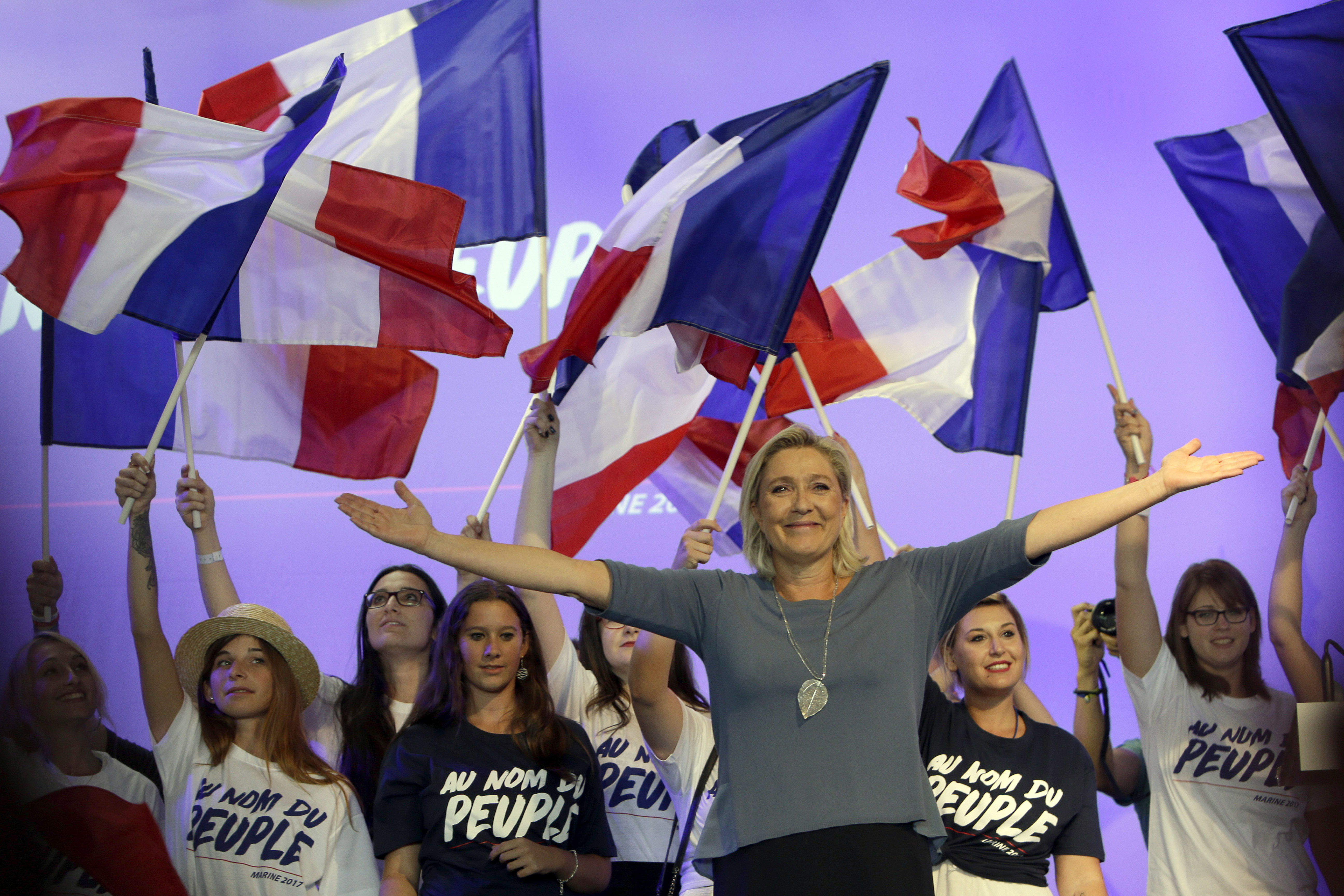 France's far-right National Front president Marine Le Pen waves to supporters during the summer meeting, 'Les Estivales de Marine Le Pen', in Frejus, southern France, Sunday, Sep. 13, 2016. (AP Photo/Claude Paris)